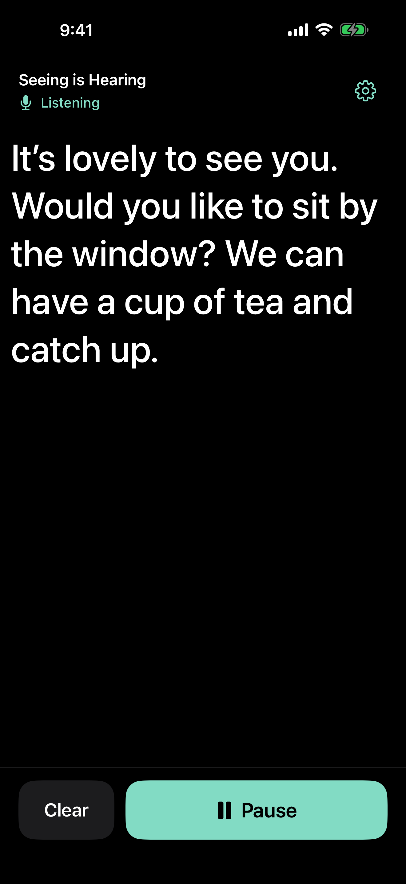 Seeing is Hearing on iPhone, showing large live captions in dark appearance.